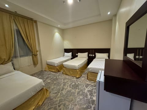 Deluxe Quadruple Room, City View | In-room safe, free WiFi