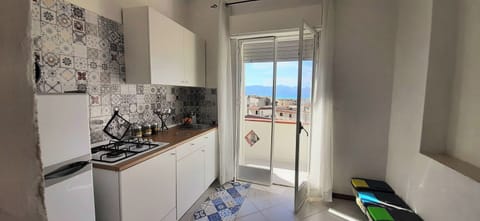 Apartment, Partial Sea View | Private kitchen | Highchair