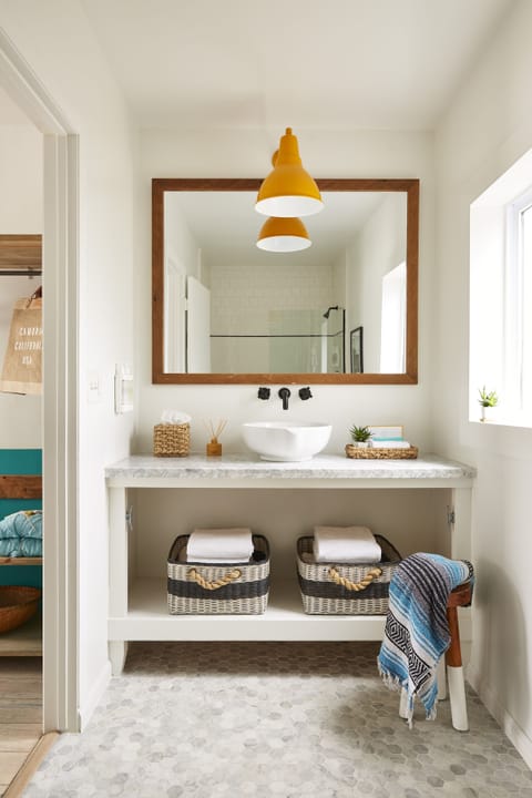 Shower, designer toiletries, hair dryer, towels