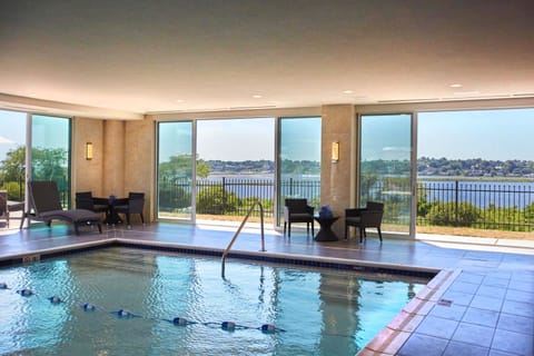 Indoor pool, pool umbrellas, sun loungers