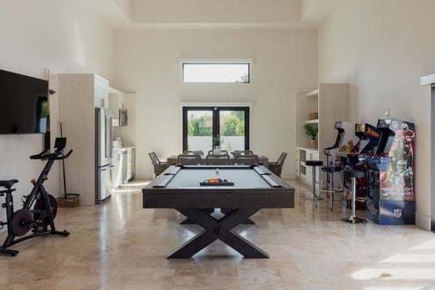 Your own game room equipped with a pool table & arcade games for some friendly competition. You'll also have use of a spin bike to stay active, a large living room and kitchenette!