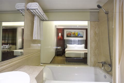 Executive Suite, 1 King Bed, City View | Bathroom | Spring water tub, rainfall showerhead, designer toiletries, hair dryer