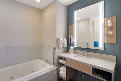 Suite, 1 Bedroom, Jetted Tub | Bathroom | Combined shower/tub, deep soaking tub, hydromassage showerhead