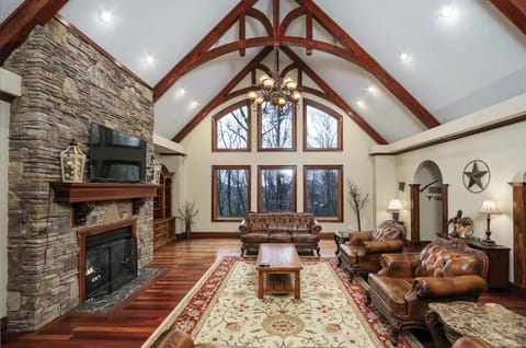 Gorgeous property w/vaulted ceiling, stacked stone fireplace, cherrywood floors