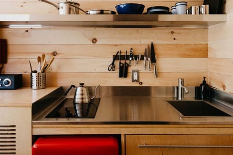 Mini-fridge, stovetop, cookware/dishes/utensils