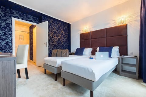 Get a peaceful night sleep in our cozy bedroom, which has 2 Single Italian beds.