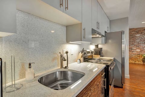 Kitchen: A fully equipped kitchen with sleek, modern appliances for all your cooking needs.