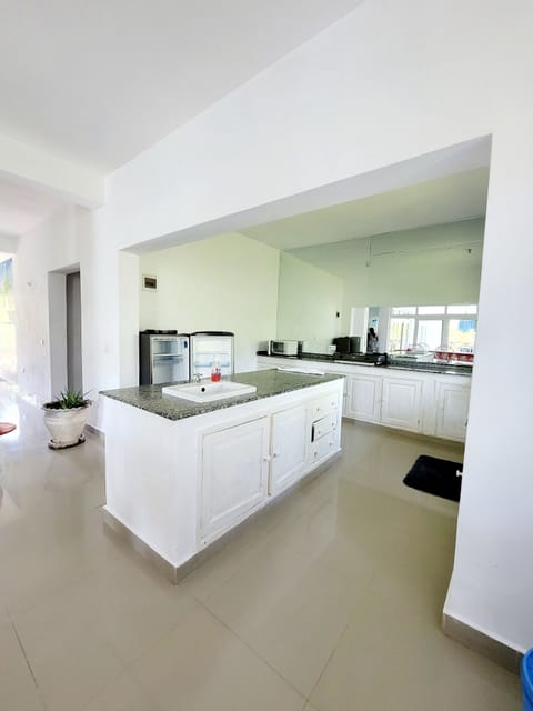 Luxury Apartment, Pool View | Private kitchen | Fridge, microwave, oven, stovetop