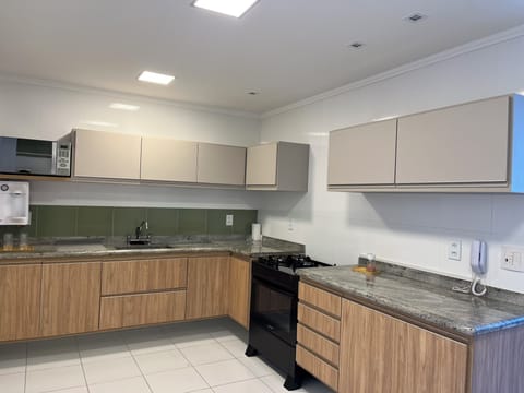 Deluxe Apartment, Balcony, Sea View | Private kitchen | Full-size fridge, microwave, oven, highchair