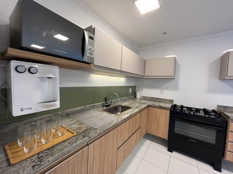 Deluxe Apartment, Balcony, Sea View | Private kitchen | Full-size fridge, microwave, oven, highchair