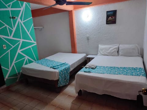 Economy Double Room, 2 Double Beds, Beachside | Free WiFi, bed sheets