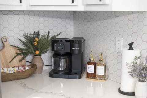 Start your morning in style with our sleek coffee station – perfect for brewing your favorite cup of luxury.
