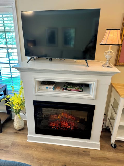 Electric fireplace with virtual flame and heat blower