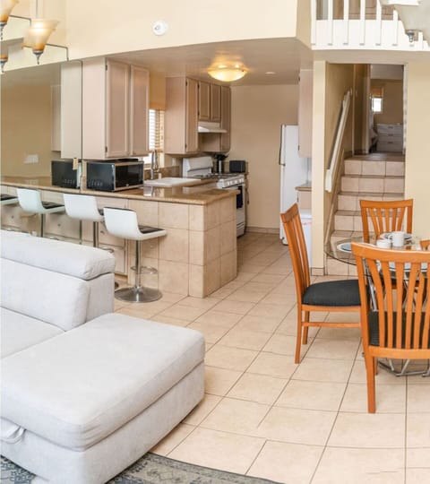 Kitchen and dining rooms extend from living room to enhance socializing.