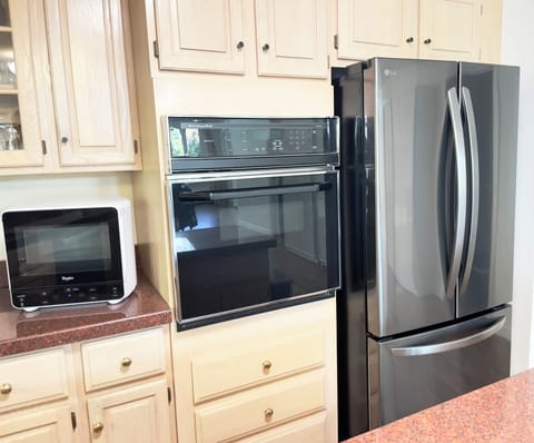 Brand new refrigerator, electric oven and microwave.