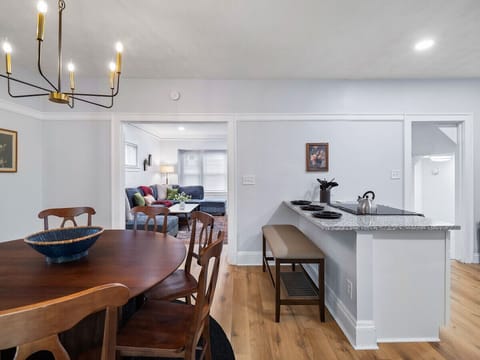 Our sophisticated dining area, adjacent to a modern kitchen, offers the perfect setting for memorable dining experiences