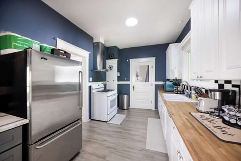 Fully equipped kitchen with modern appliances and ample counter space.