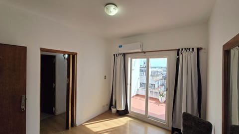 Deluxe Suite, Balcony, City View | Living area | 32-inch Smart TV with cable channels