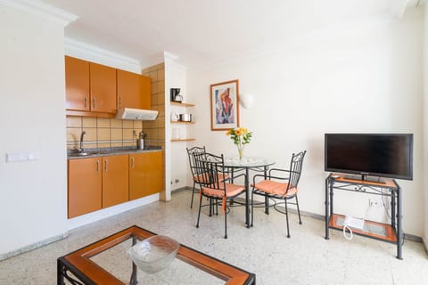 Apartment, Balcony, Pool View | Private kitchen | Full-size fridge, stovetop, coffee/tea maker, electric kettle