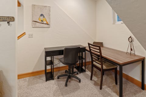 Two large desks set up for those who need to work on their vacation.