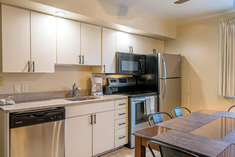 Kitchen Suite, 3 Queen Beds | Private kitchen | Fridge, microwave, coffee/tea maker