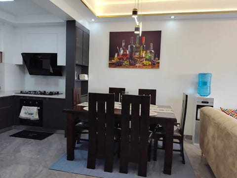 Family Apartment, Balcony, City View | Private kitchenette | Microwave, cookware/dishes/utensils, dining tables