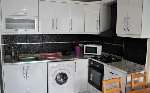 Economy Apartment, Balcony, Garden View | Private kitchen | Full-size fridge, microwave, oven, stovetop