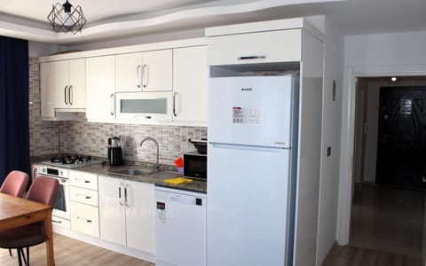 Economy Apartment, Balcony, City View | Private kitchenette | Microwave, oven, stovetop, highchair