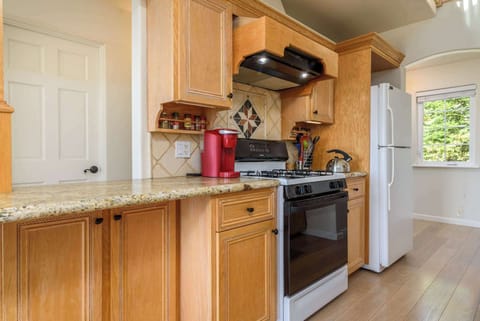 The open, airy kitchen offers ample space & every home comfort