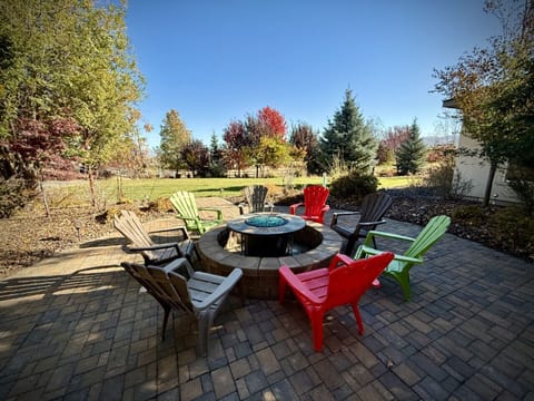 Gas firepit with Adirondack chairs - shared space with Casita 1 and the main home