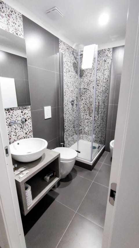 Superior Studio Suite, City View | Bathroom | Shower, hair dryer, towels, soap