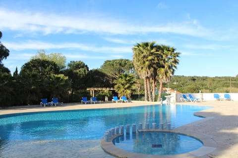 Outdoor pool, open 9:00 AM to 7:00 PM, pool umbrellas, sun loungers