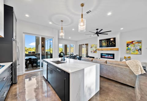 This bright and airy dining space invites everyone to gather for meals, games, and memories, all with beautiful views around.