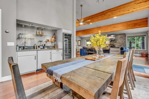 Dining Room: 6-person dining table, bar area, large wine fridge, adjacent to kitchen and living room