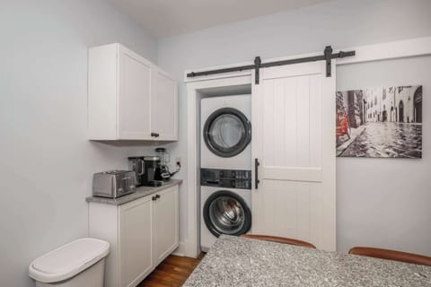 Private laundry is available for your stay, tucked away off the kitchen