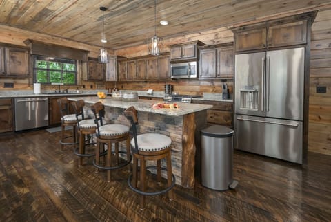 Rustic charm and modern shine combine in this cozy, fully equipped kitchen.