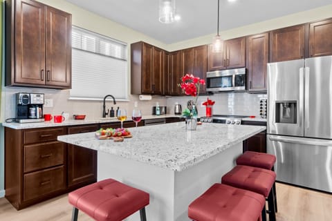 Stylish kitchen island featuring extra seating, perfect for casual meals and gathering with friends and family