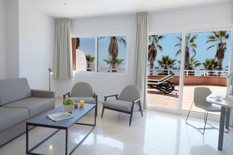 Suite, Sea View | Living area | 26-inch flat-screen TV with satellite channels, TV, foosball