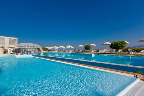 Outdoor pool, open 9:00 AM to 7:00 PM, pool umbrellas, sun loungers