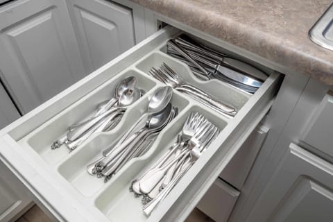 The kitchen is stocked with ample amenities for an unforgettable getaway