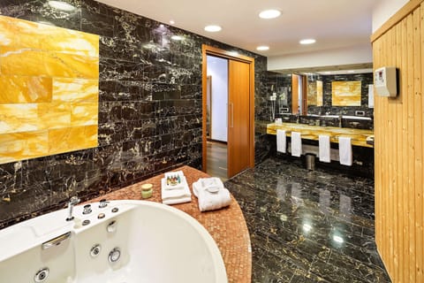 Suite | Bathroom | Deep soaking tub, hair dryer, slippers, towels