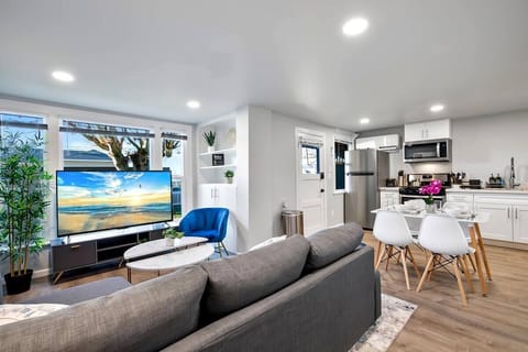 Enjoy the open-concept layout with seamless transitions from the living room to the dining and kitchen areas, perfect for socializing