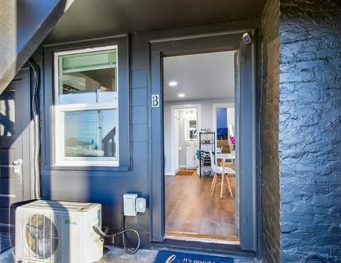 A welcoming view of the unit's entrance, showcasing a modern design with easy access.