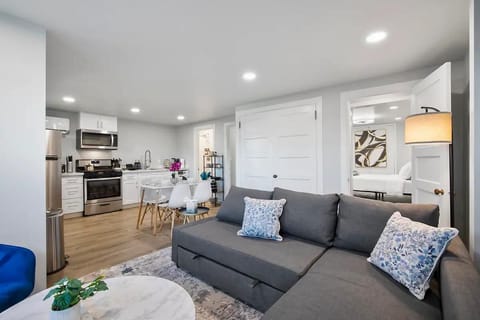 The heart of the home – gather around the dining table or lounge on the inviting sectional, all within this bright and airy space