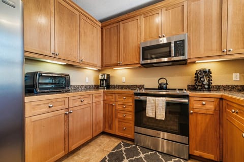 Clean open kitchen with warm lighting