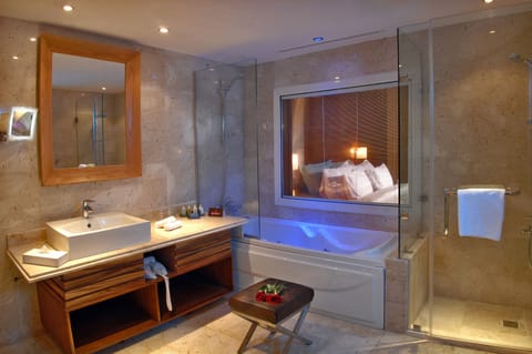 Sensatori Suite | Bathroom | Shower, designer toiletries, hair dryer, bathrobes