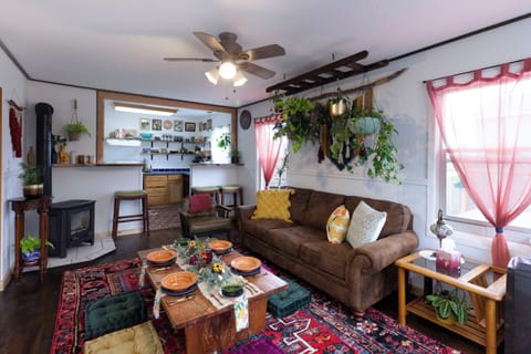 Cozy living room view looking into kitchen.