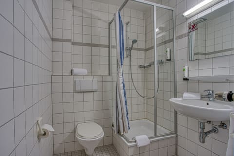 Shower, rainfall showerhead, hair dryer, towels