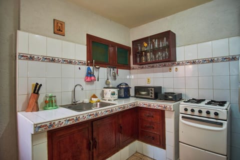 Family Apartment, Kitchen, Courtyard View | Private kitchen | Full-size fridge, microwave, oven, stovetop