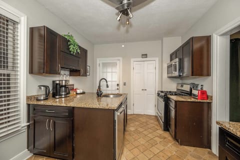 The stylish kitchen offers ample space & all the comforts of home